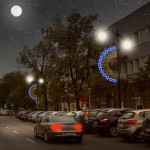 Ośnieżone miasto nocą, auta na ulicy, oświetlenie uliczne w kształcie gwiazd - komponenty elektryczne i oświetlenie Polamp
